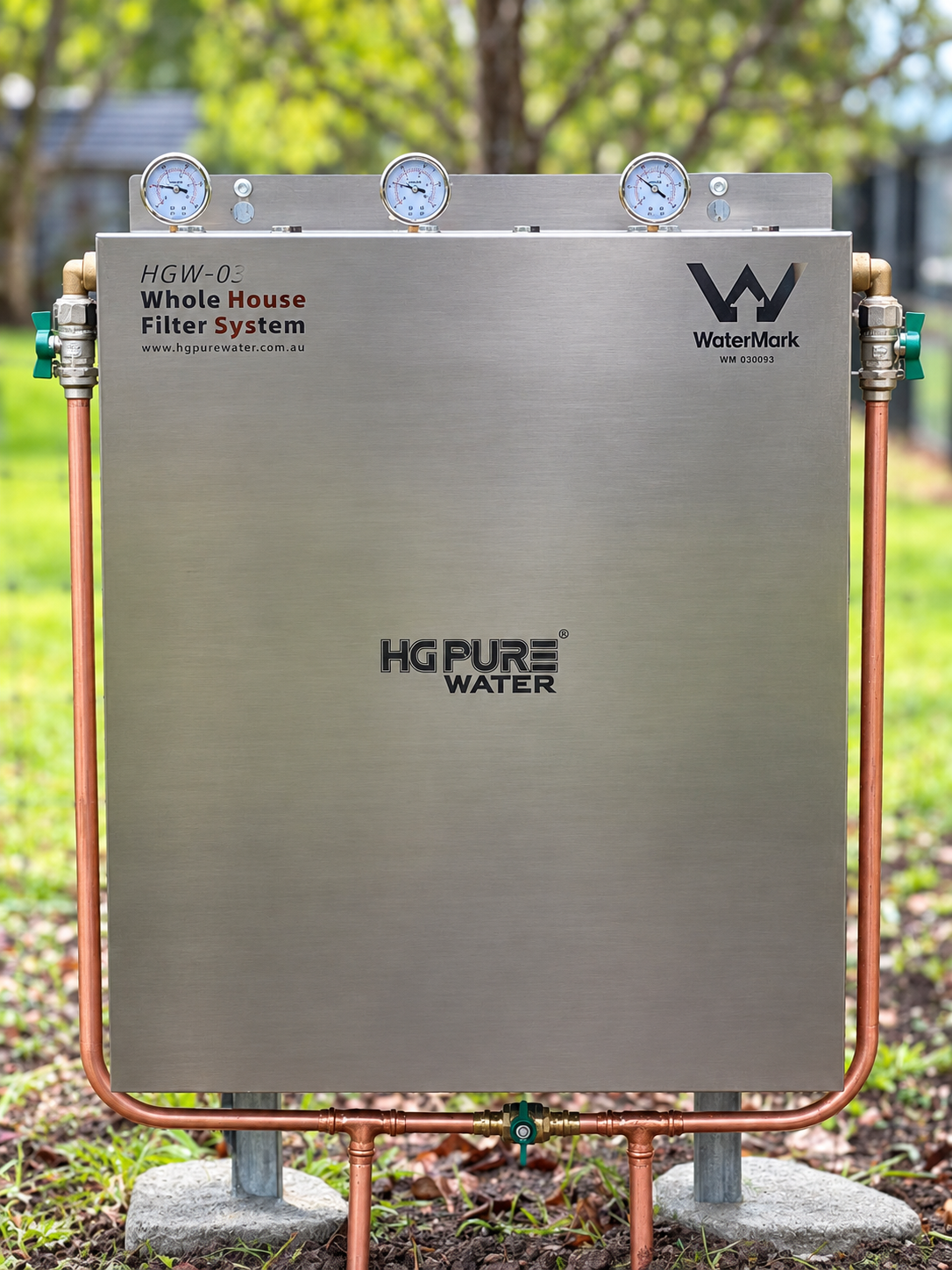 HGW-03 whole-house filter installed outdoors with three pressure gauges, a stainless-steel cover and copper pipework